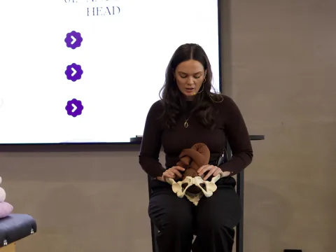Gabrielle teaching with a pelvis model at our October workshop